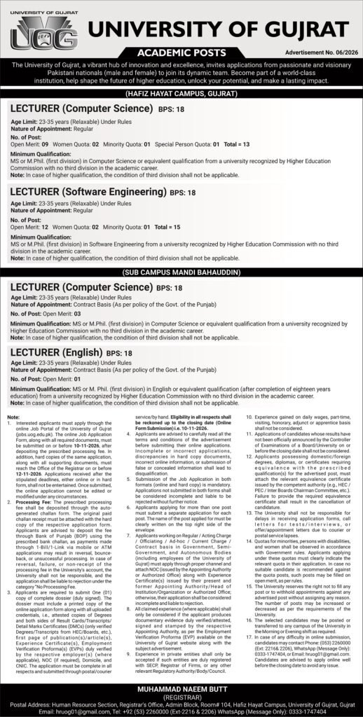 Two smiling lecturers in a university computer lab for UOG lecturer jobs 2026